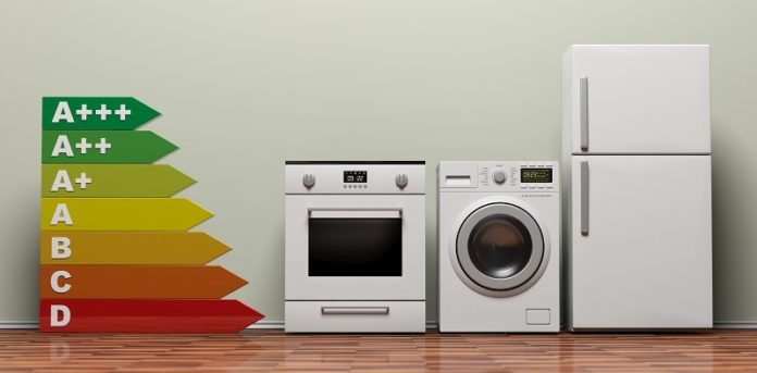Home appliances set and energy efficiency chart on wooden floor. 3d illustration